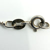 Close-up of necklace clasp and tag stamped “925 ITALY” on sterling silver box chain.
