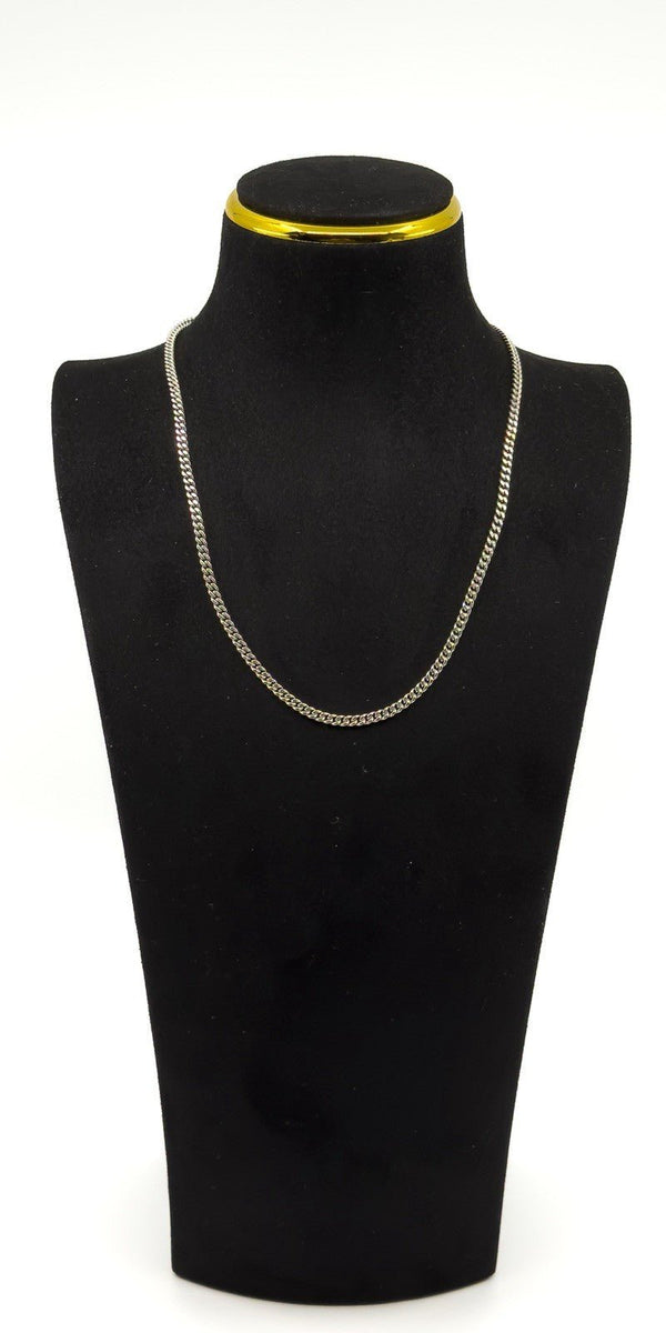 Sterling silver 18 inch flat curb chain shown on a display bust for fit and drop.