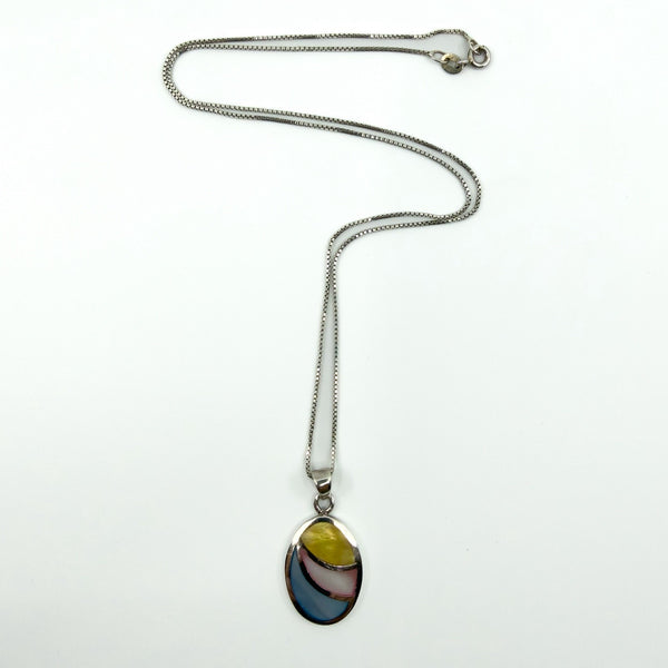 Sterling silver oval inlay pendant on fine box chain, multicolour mother of pearl style panels, white background.
