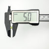 Green CZ stud earring being measured at 5.0mm with digital caliper