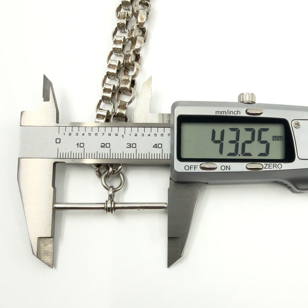Calipers measuring the sterling silver T-bar length on the Albert chain (43.25mm shown).