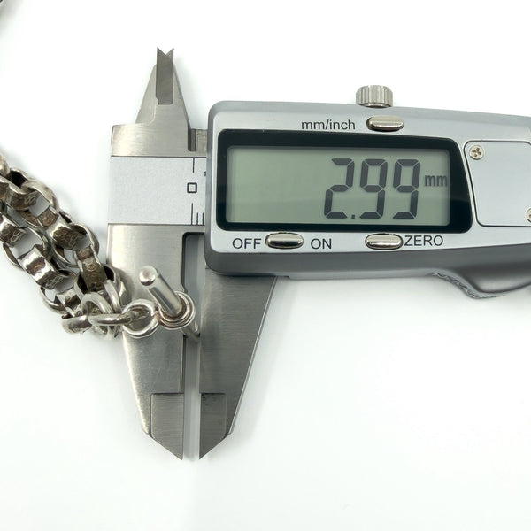 Calipers measuring the sterling silver T-bar thickness on the Albert chain (2.99mm shown).