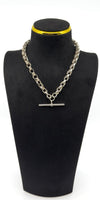 Sterling silver Albert chain showing large T-bar and double dog clips on a chunky fancy link chain.