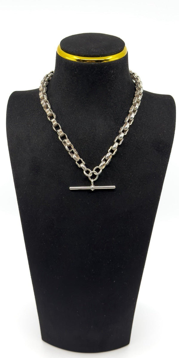 Sterling silver Albert chain showing large T-bar and double dog clips on a chunky fancy link chain.