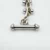 Close-up of classic T-bar fastening on solid sterling silver bracelet