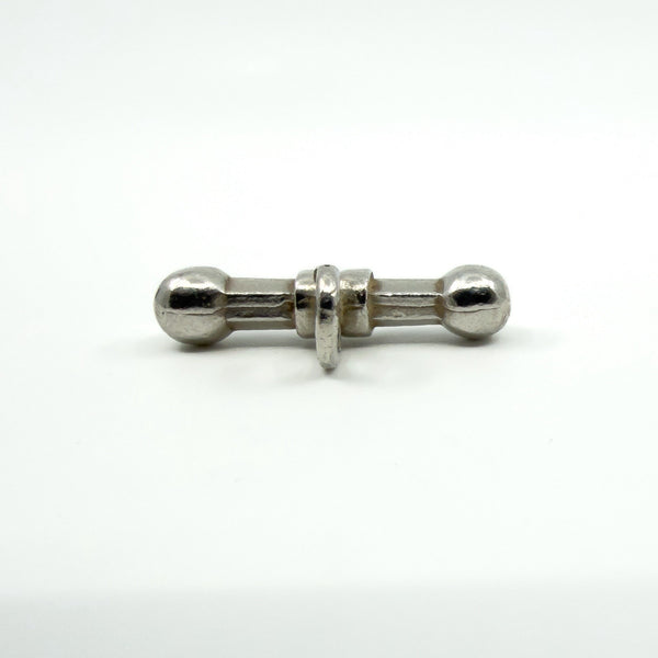 Front view of chunky sterling silver T-bar pendant with central band detail and bail.