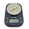 Sterling silver T-bar pendant on digital scales showing an approximate weight of 7.47g.