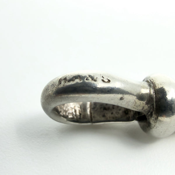 Macro of the T-bar showing the S.S stamp on the sterling silver Albert chain.