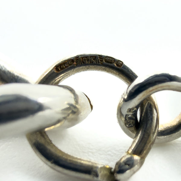 Close-up of TGCC maker mark, 925 and London leopard head on clasp ring.