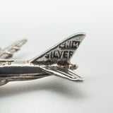 Close-up of aircraft tail showing 'SILVER' stamp and detailing on the rudder