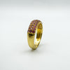 Elevated angle of pavé ruby ring in sterling silver with gold overlay