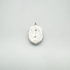 Back of chunky sterling silver Christian cross pendant showing hammered texture