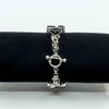 Sterling silver black onyx bracelet on display roll showing toggle clasp and chain detail