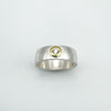 Top view of chunky silver CZ ring with gold bezel setting