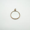 Edwardian gold photo locket pendant viewed from above showing glass and gold band