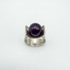 Top view of vintage sterling silver ring with central amethyst ball