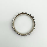 Overhead view of antique silver garnet ring showing circular shape and profile
