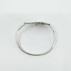 Flat overhead view showing oval shape and decorative spiral detail of bangle