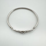 Overhead view showing oval shape and full band of sterling silver bangle