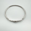 Overhead view showing oval shape and full band of sterling silver bangle