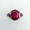 Top-down view showing oval centre ruby and two pinker round rubies
