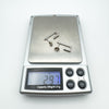 Digital scale showing total weight of sterling silver J hoop earrings as 2.97g