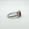 Side band view showing depth of setting and polished silver finish