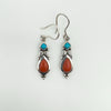 Dangly sterling silver earrings with turquoise and coral cabochons, front view