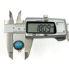 Calipers showing the turquoise diamond halo ring head measuring approximately 18mm