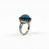Raised side view of the sterling silver turquoise and diamond halo ring