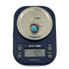 Sterling silver turquoise diamond halo ring on digital scales showing approximately 4g