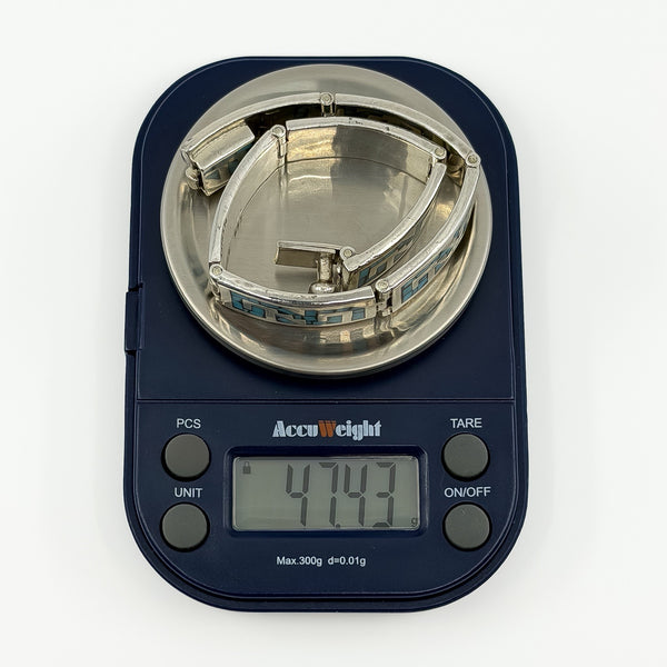 Digital scale showing the chunky sterling silver turquoise panel bracelet weighing approximately 47.4g