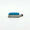 Opposite side view of sterling silver turquoise pendant showing the thick silver setting and bail