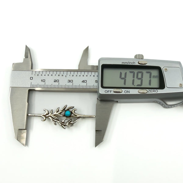 Digital caliper showing the brooch length at approximately 47.97mm for the sterling silver turquoise brooch.
