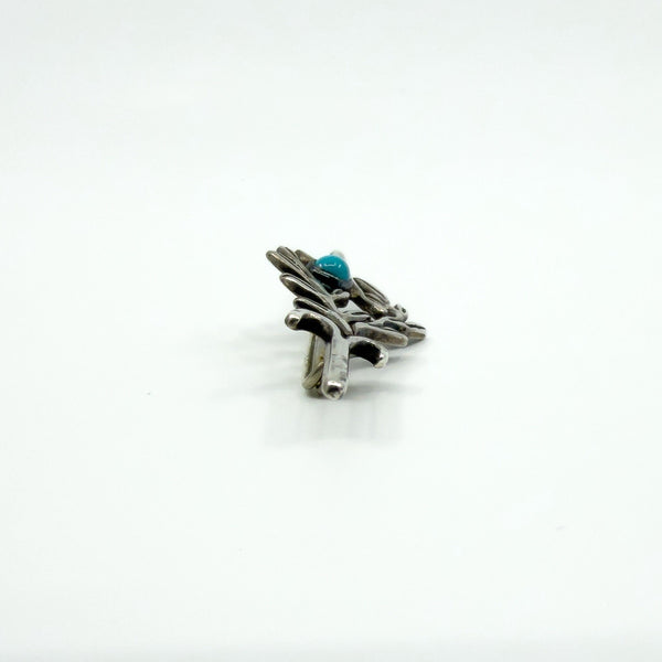 Side view of the sterling silver turquoise brooch showing the cabochon setting height and pin fitting.