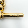 Italian hallmarks stamped on vintage 9ct gold T-bar charm marked UNOAERRE