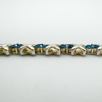 Rear view of blue CZ bracelet showing silver X link structure