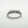 Back of the sterling silver ring showing the open gallery beneath the pink rhodolite garnet settings