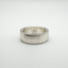 Underside of chunky silver band with view of CZ stone backing