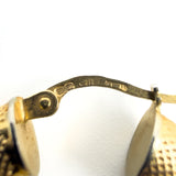 Close up of UnoAErre 375 hallmark on vintage 9ct gold mesh hoop earring