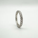 Upright platinum eternity ring with prong-set natural diamonds
