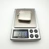 Antique silver vesta case shown on digital scale at 23.17 grams