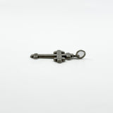 Side profile of Victorian sterling silver cross pendant showing engraved front and large bail