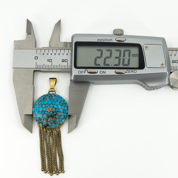 Digital caliper showing the Victorian 18ct gold turquoise tassel locket measuring approximately 22.30mm wide.