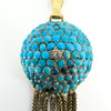 Close-up of pavé-set natural turquoise and rose-cut diamond on the Victorian 18ct gold tassel locket.