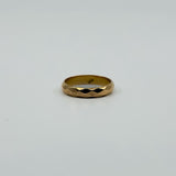 Vintage 18ct rose gold faceted band ring shown front facing with 18k stamp visible inside.
