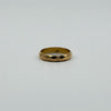Vintage 18ct rose gold faceted band ring shown front facing with 18k stamp visible inside.