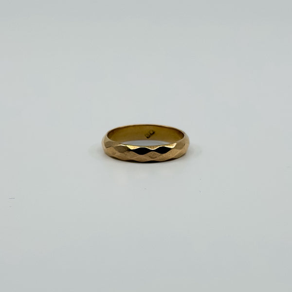 Vintage 18ct rose gold faceted band ring shown front facing with 18k stamp visible inside.