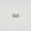 Front view of vintage 9ct gold stud earrings set with round white cultured pearls approximately 7mm in diameter.
