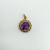 Close-up front view of vintage 9ct gold amethyst pendant with round cut stone